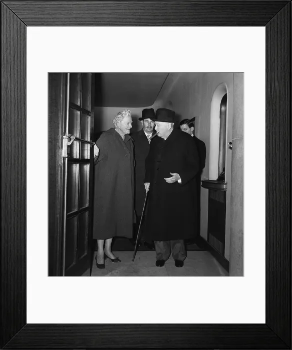 Framed Print : Sir Winston Churchill with his wife Lady Churchill leaving a side entrance of the Savoy