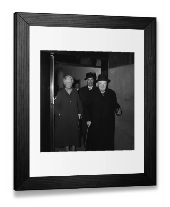 Framed Print : Sir Winston Churchill with his wife Lady Churchill leaving a side entrance of the Savoy