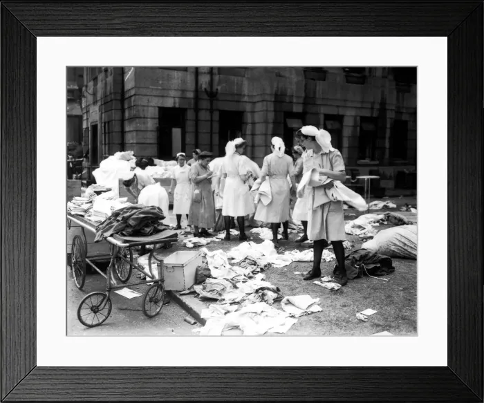 Framed Print : Nurses sorting linen outside Lewisham hospital after raid on the hospital the night Framed Print : Nurses sorting linen outside Lewisham hospital after raid on the hospital the night