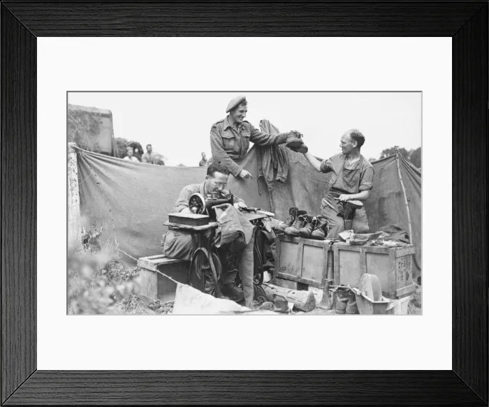 Framed Print : WW2 August 1944 Front line tailor and cobbler. Private Peter Barnes collects his Framed Print : WW2 August 1944 Front line tailor and cobbler. Private Peter Barnes collects his