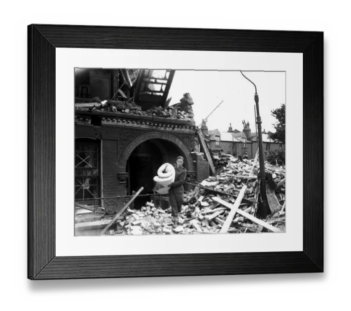 Framed Print : WW2 Air Raid Damage Tooting Bomb damage at Tooting London A soldier carries Framed Print : WW2 Air Raid Damage Tooting Bomb damage at Tooting London A soldier carries