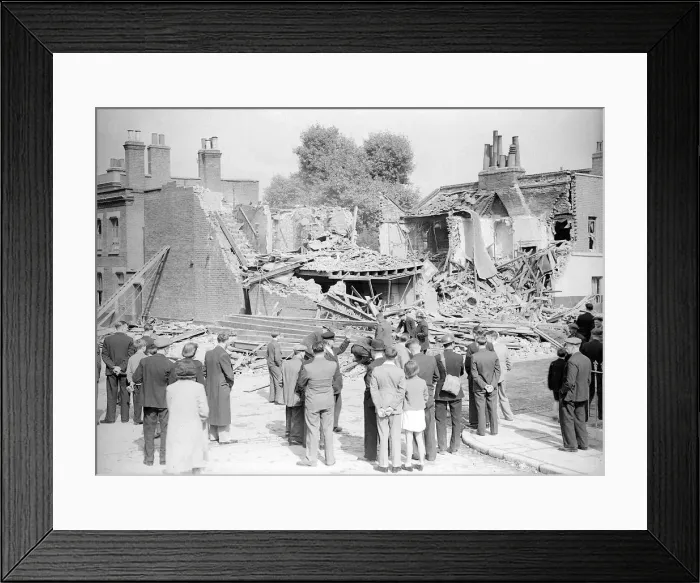 Framed Print : WW2 The Blitz Bomb damage in London Local residents stop to look at bomb Framed Print : WW2 The Blitz Bomb damage in London Local residents stop to look at bomb