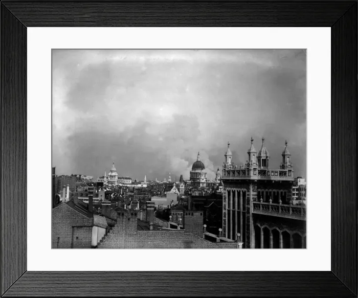 Framed Print : Smoke rises from behind the dome of St Pauls Cathedral after the first daylight bombing Framed Print : Smoke rises from behind the dome of St Pauls Cathedral after the first daylight bombing