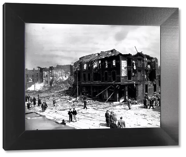 WW2 Air Raid Damage Bomb damage at Liverpool - people stand in the street looking