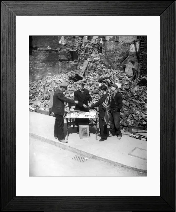 Framed Print : WW2 Tobaconist sales cigarette outside his bombed shop Framed Print : WW2 Tobaconist sales cigarette outside his bombed shop