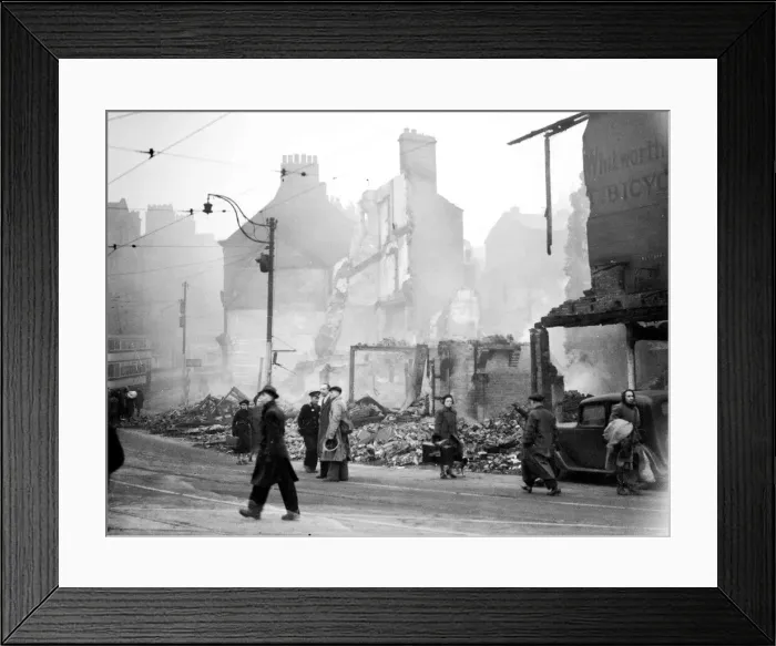 Framed Print : WW2 Air Raid Damage People walking along a high street in Sheffield which had been