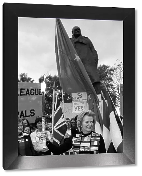 Mrs Margaret Thatcher March 1975 holding the European flag under the statue of Sir