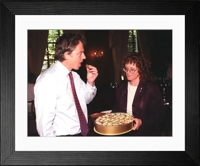 Framed Print : British Prime Minister Tony Blair accepts a chocolate from Judy Mallaber MP for Amber Framed Print : British Prime Minister Tony Blair accepts a chocolate from Judy Mallaber MP for Amber