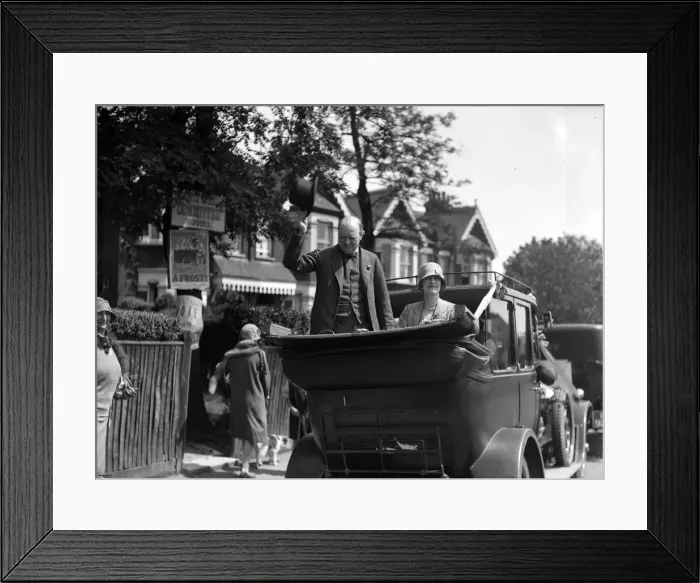Framed Print : Winston Churchill is seen with his wife Clementine Churchill in an open topped car Framed Print : Winston Churchill is seen with his wife Clementine Churchill in an open topped car