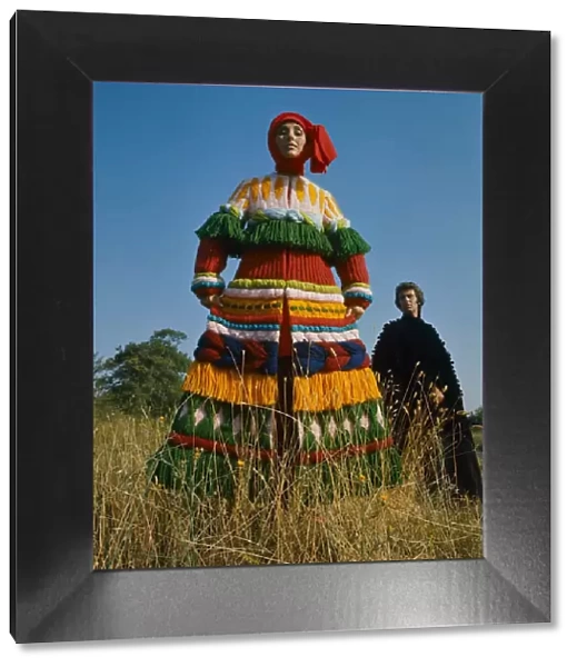 Model wearing a knitted wool Russian styled peasant costume designed by Carosa
