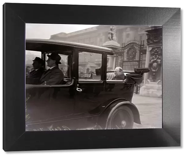 Winston Churchill leaving Buckingham Palace in an open top car after receiving the seal