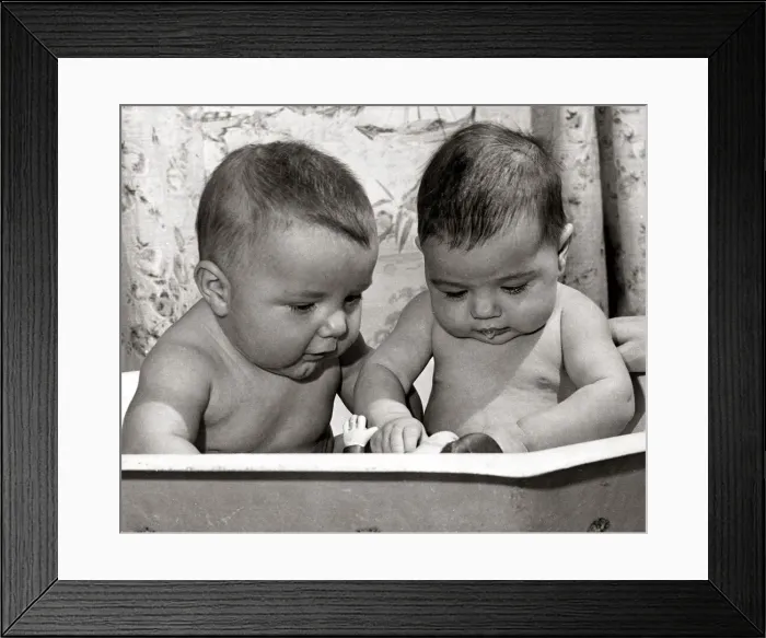 Framed Print : Four month old Lorne Brown (left) and three month old Katherine Weldon taking a bath