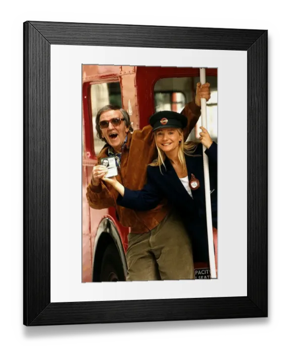 Framed Print : Lynn Parsons Radio One disc jockey with colleague Alan Freeman holding a bus pass DBase Framed Print : Lynn Parsons Radio One disc jockey with colleague Alan Freeman holding a bus pass DBase