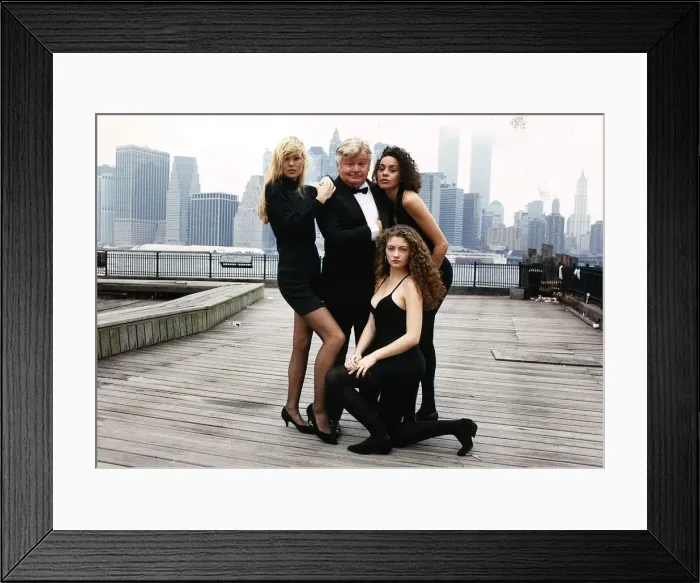 Framed Print : Benny Hill standing on the harbour side in New York dressed as a James Bond style secret Framed Print : Benny Hill standing on the harbour side in New York dressed as a James Bond style secret