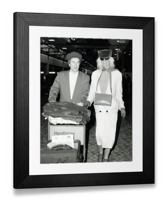 Framed Print : John Lydon and his wife Nora Lydon leaving London Airport Heathrow for Miami