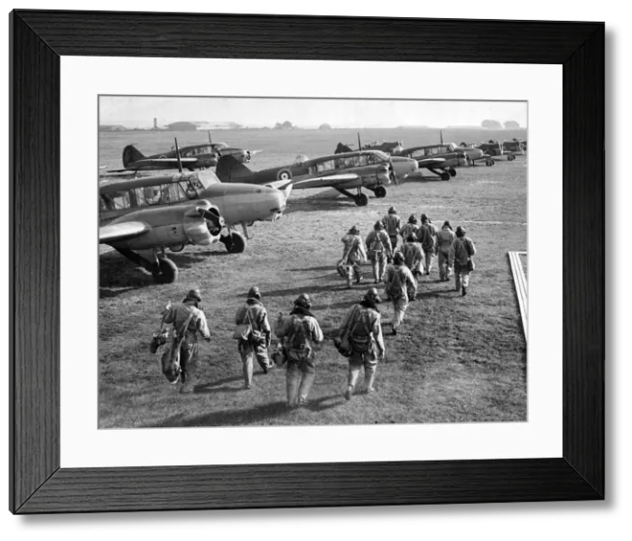 Framed Print : RAF pilots and crew make their way to their Avro Anson planes during World War Two