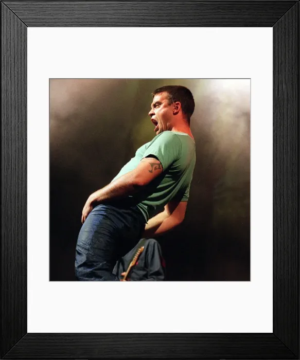 Framed Print : Robbie Williams in concert at slane castle August 1999 Gyrating to the fans