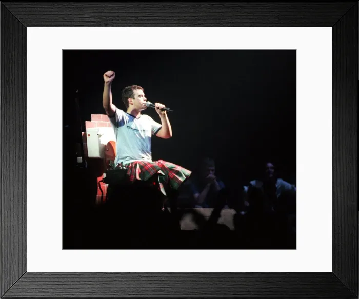 Framed Print : Robbie Williams wearing kilt sitting on toilet February 1999 during SECC concert Glasgow