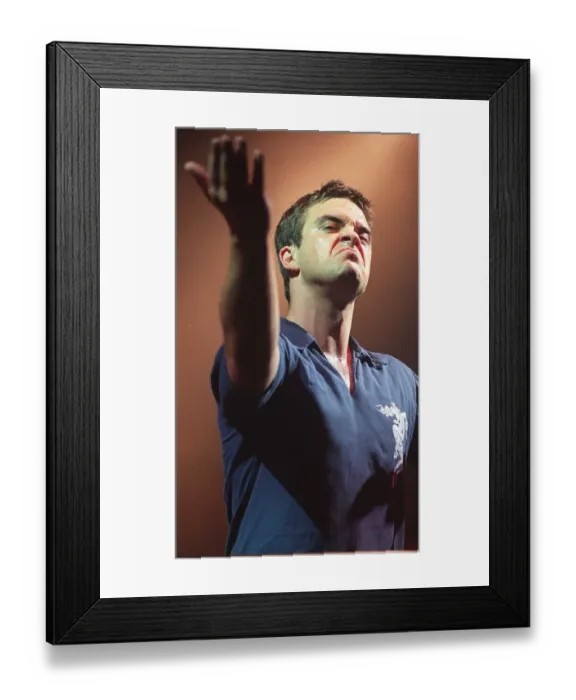 Framed Print : Robbie Williams makes a face to the audience at his concert at the SECC Glasgow February Framed Print : Robbie Williams makes a face to the audience at his concert at the SECC Glasgow February