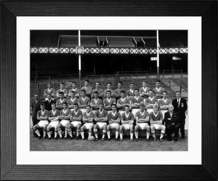 Framed Print : The Everton team pose with staff and trainers for a photograph on the pitch at Goodison Framed Print : The Everton team pose with staff and trainers for a photograph on the pitch at Goodison