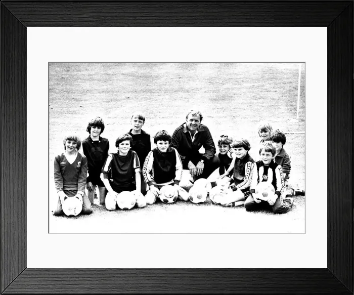 Framed Print : Former England footballer Bobby Moore coaches children at the Coral sponsored Bobby Moore Framed Print : Former England footballer Bobby Moore coaches children at the Coral sponsored Bobby Moore