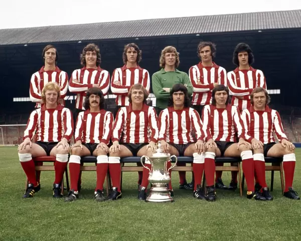 The Sunderland FA Cup winning team pose with the trophy at their Roker Park ground