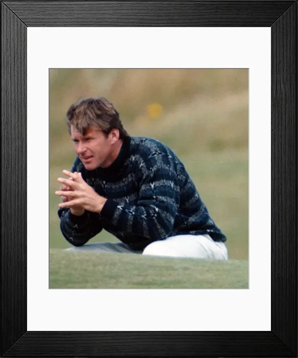Framed Print : Nick Faldo at the British Open Golf Championship 1995, squats on the 16th green at St
