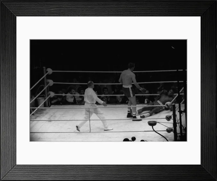 Framed Print : Action during the non-title heavyweight fight between American Cassius Clay
