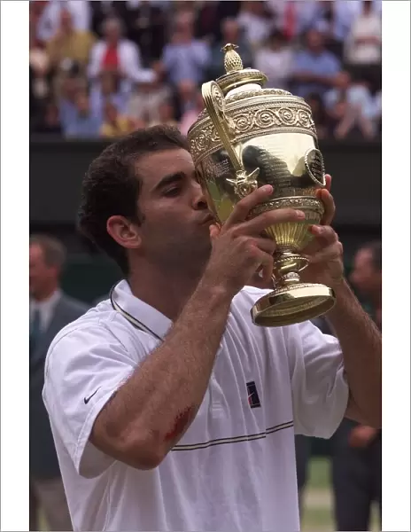 Pete Sampras kisses trophy after victory at Wimbledon 1999 after beating Andre Agassi in