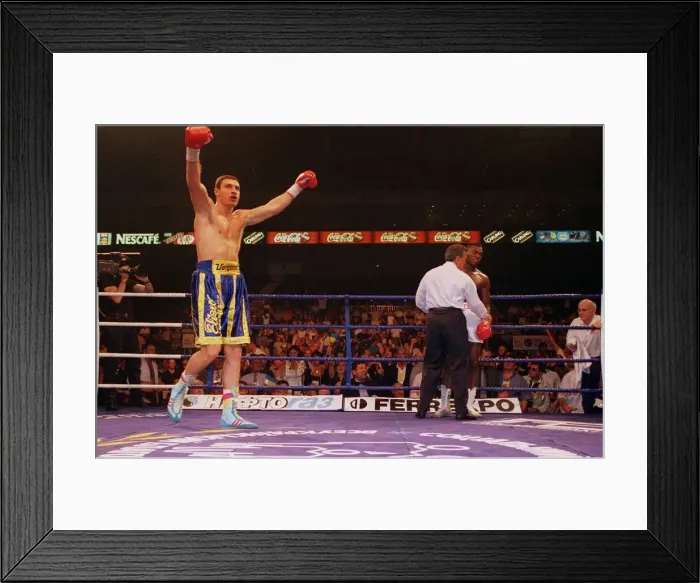 Framed Print : Vitali klitschko with arms in the air after knocking out britians Herbie Hide in two