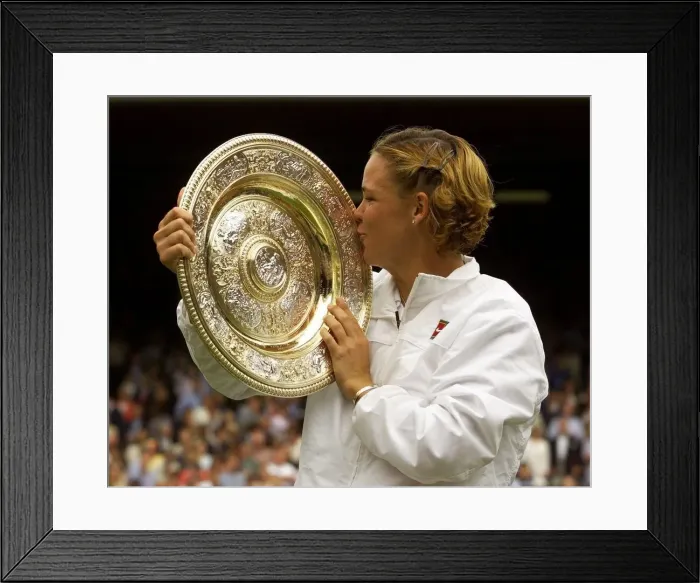 Framed Print : Lindsay Davenport of the U. S. July 1999 holding and kissing the trophy after