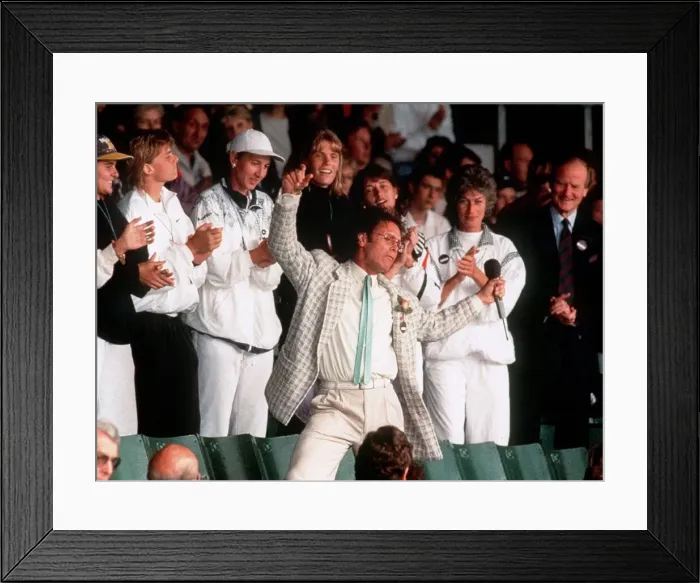 Framed Print : Cliff Richard entertains the tennis fans during a break in play due to the weather Framed Print : Cliff Richard entertains the tennis fans during a break in play due to the weather