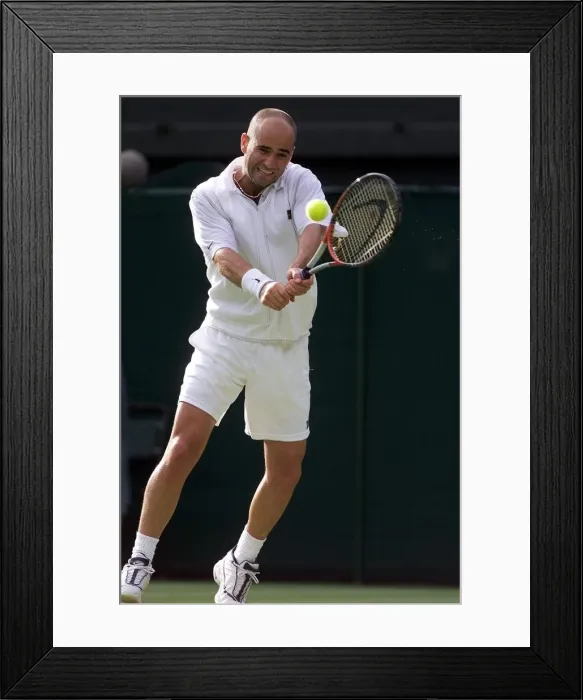 Framed Print : Andre Agassi on his way to beating Andrei Pavel in the first round of the mens singles of Framed Print : Andre Agassi on his way to beating Andrei Pavel in the first round of the mens singles of