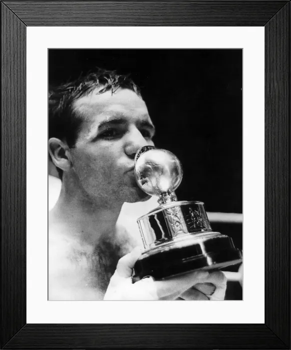 Framed Print : Walter McGowan kisses title trophy after win London 1966 beating Salvatore Burruni Framed Print : Walter McGowan kisses title trophy after win London 1966 beating Salvatore Burruni