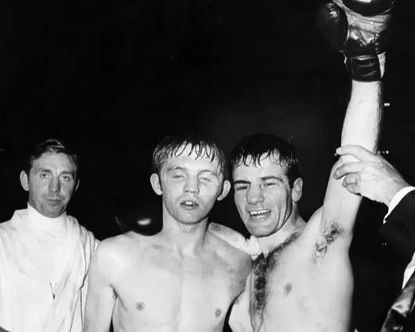 Walter McGowan boxer arm raised celebrates winning victory arm around opponent flyweight