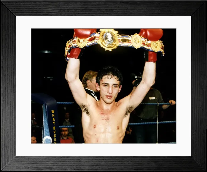 Framed Print : Gary Jacobs boxer holding up his title belt red gloves, 1992