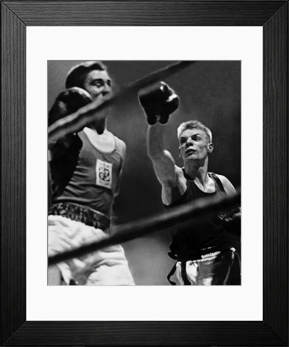 Framed Print : Dick McTaggart boxer throwing punch boxing during fight against ropes. Circa 1958 Framed Print : Dick McTaggart boxer throwing punch boxing during fight against ropes. Circa 1958