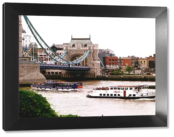 London Tourists on River Buses pass under Tower Bridge
