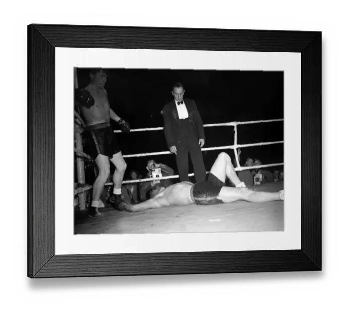 Framed Print : Tommy Farr looks down on his opponent Jan Klein when they met 27  /  9  /  1950