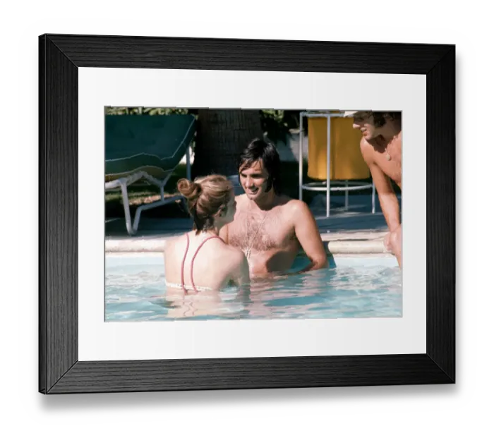 Framed Print : Footballer George Best relaxes with girlfriend Linda Joinett in a swimming pool in Palm Framed Print : Footballer George Best relaxes with girlfriend Linda Joinett in a swimming pool in Palm
