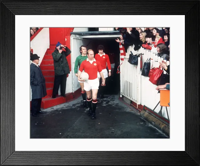 Framed Print : Bobby Charlton, Manchester United football player, leading out the team from tunnel Framed Print : Bobby Charlton, Manchester United football player, leading out the team from tunnel
