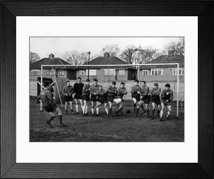 Framed Print : Liverpool Goalkeeper Tommy Lawrence takes a pot shot at the rest of the team