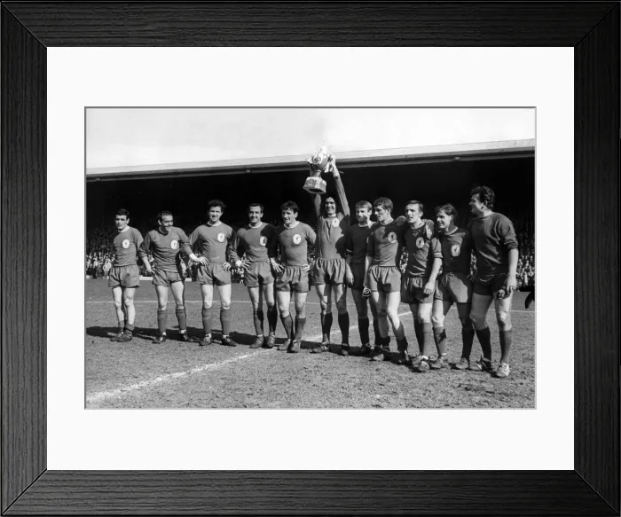 Framed Print : Liverpool captain Ron Yeats holds aloft a mock League Championship trophy for the crowd Framed Print : Liverpool captain Ron Yeats holds aloft a mock League Championship trophy for the crowd