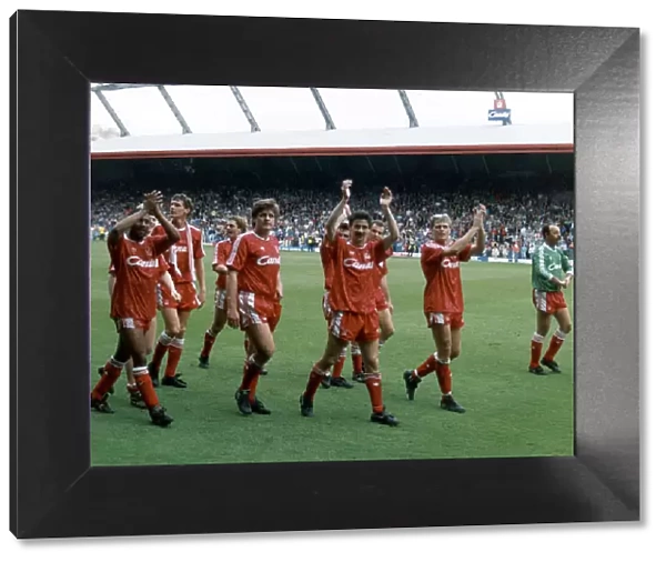 Liverpool players acknowledge their fans and celebrate winning the League Championship at
