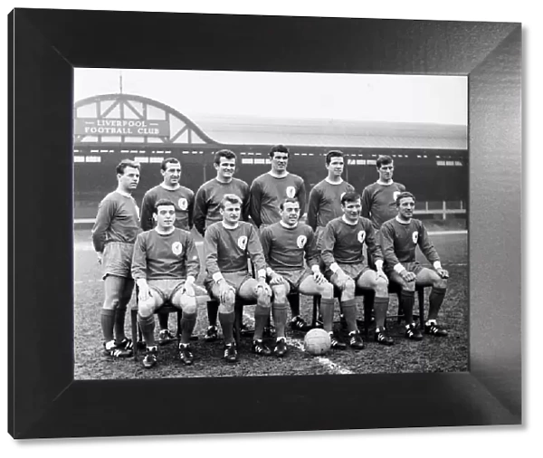 Liverpool team pose for a group picture on the pitch at Anfield before the start of
