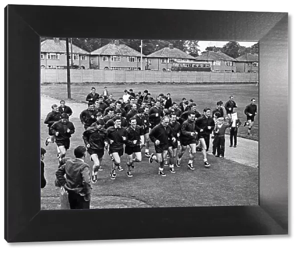 Schoolchildren watch Liverpool team training session at Melwood February 1965