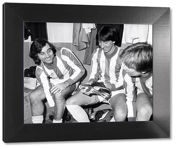 George Best gets changed into the No. 7 Nuneaton Borough shirt