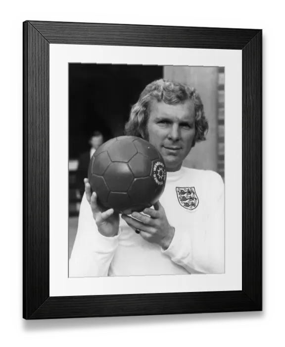 Framed Print : England football captain Bobby Moore with a Wembley Club trainer football. Circa 1970 Framed Print : England football captain Bobby Moore with a Wembley Club trainer football. Circa 1970