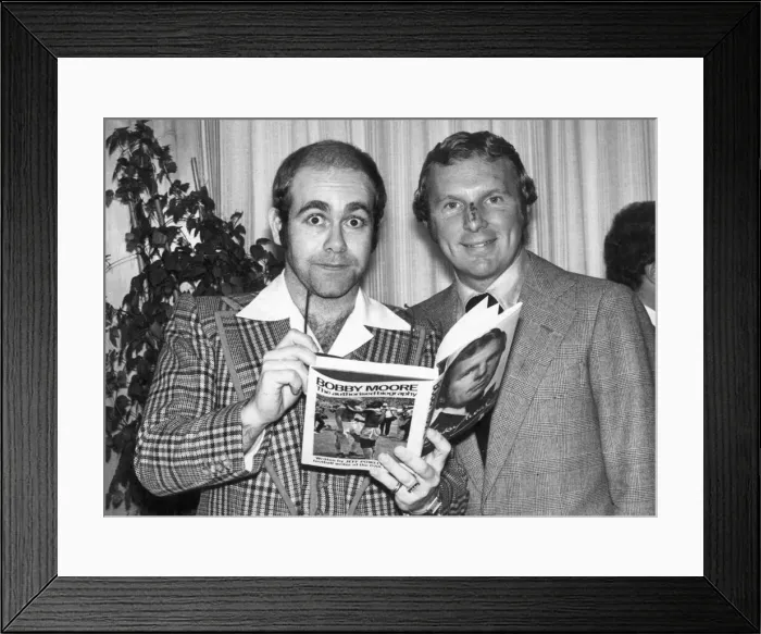 Framed Print : Pop star Elton John also chairman of Watford football club seen here with Bobby Moore Framed Print : Pop star Elton John also chairman of Watford football club seen here with Bobby Moore
