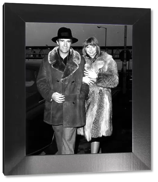 Malcolm Allison football manager seen here at Heathrow airport with partner
